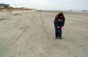 Kristin measures the sand compaction on a nourished beach