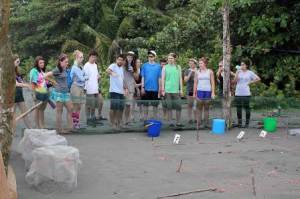 The group looks over the turtle nursery where hatchlings will boil from their nests